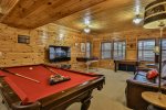 Terrace level game room with pool table foosball and air hockey